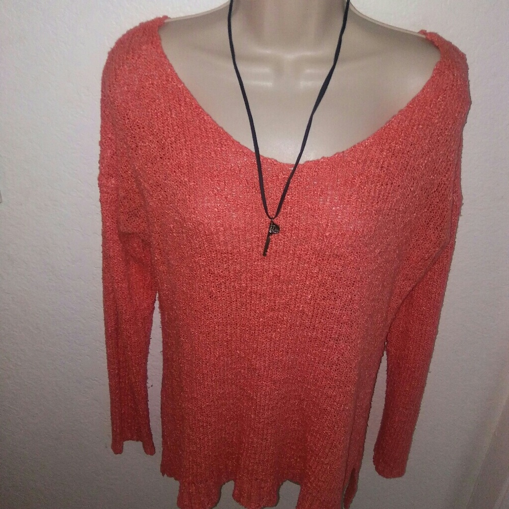 Coral sweater throw on